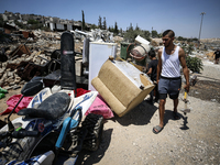 Commercial structures and animal shelters in the area are being demolished as Israeli forces conduct a raid in the At-Tur neighborhood of Ea...