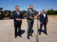 (L-R) Secretary of State in the Ministry of Defence of Poland, Pawel Bejda,  Deputy Prime Minister and Minister of Defence of Poland, Wladys...