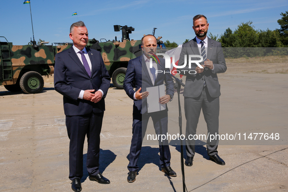 (L-R)Secretary of State in the Ministry of Defence of Poland, Pawel Bejda, Pawel Matenczuk,  Deputy Prime Minister and Minister of Defence o...