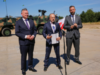 (L-R)Secretary of State in the Ministry of Defence of Poland, Pawel Bejda, Pawel Matenczuk,  Deputy Prime Minister and Minister of Defence o...