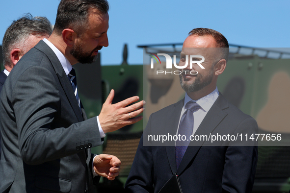 Deputy Prime Minister and Minister of Defence of Poland, Wladyslaw Kosiniak Kamysz speaks to Pawel Matenczuk during a ceremony of signing a...