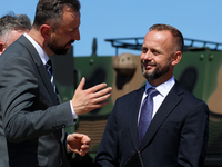 Deputy Prime Minister and Minister of Defence of Poland, Wladyslaw Kosiniak Kamysz speaks to Pawel Matenczuk during a ceremony of signing a...