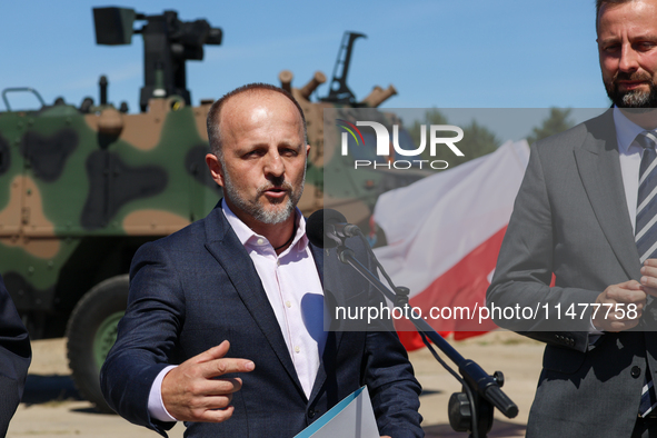 Pawel Matenczuk speaks to media during a ceremony of signing a contract to buy light armour vehicles for the Polish army in 1st Warsaw Armou...