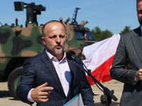 Pawel Matenczuk speaks to media during a ceremony of signing a contract to buy light armour vehicles for the Polish army in 1st Warsaw Armou...