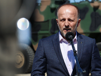 Pawel Matenczuk speaks to media during a ceremony of signing a contract to buy light armour vehicles for the Polish army in 1st Warsaw Armou...