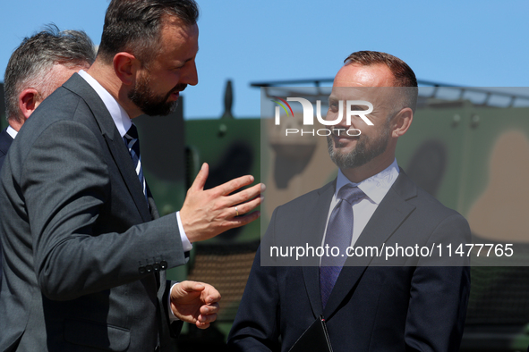 Deputy Prime Minister and Minister of Defence of Poland, Wladyslaw Kosiniak Kamysz speaks to Dariusz Fabisiak CEO of AMZ Kutno  during a cer...