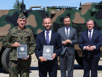 (L-R) General Artur Kuptel, Dariusz Fabisiak CEO of AMZ Kutno hold signed contract as Deputy Prime Minister and Minister of Defence of Polan...