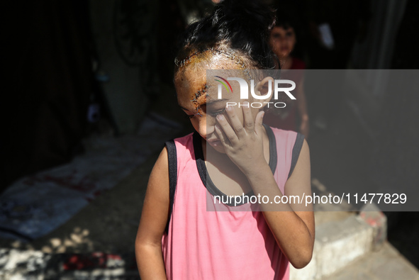 The Palestinian child Sila Houso, 7 years old, is being displaced from Gaza City to the central Gaza Strip. She is being injured during an I...