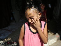 The Palestinian child Sila Houso, 7 years old, is being displaced from Gaza City to the central Gaza Strip. She is being injured during an I...