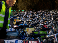 A man collects electric commercial bicycles available for public commute in central Warsaw, the capital of Poland on August 14, 2024. (