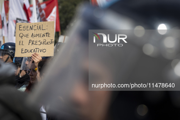 A poster is displaying the legend: ''Essential: increase the educational budget.'' during a protest of Education Workers' Union in Buenos Ai...