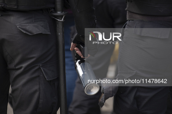 The Federal Police are holding pepper gas in their hand  during a protest of Education Workers' Union in Buenos Aires, Argentina, on August...