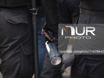 The Federal Police are holding pepper gas in their hand  during a protest of Education Workers' Union in Buenos Aires, Argentina, on August...