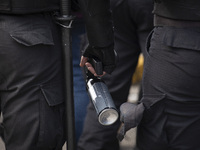 The Federal Police are holding pepper gas in their hand  during a protest of Education Workers' Union in Buenos Aires, Argentina, on August...