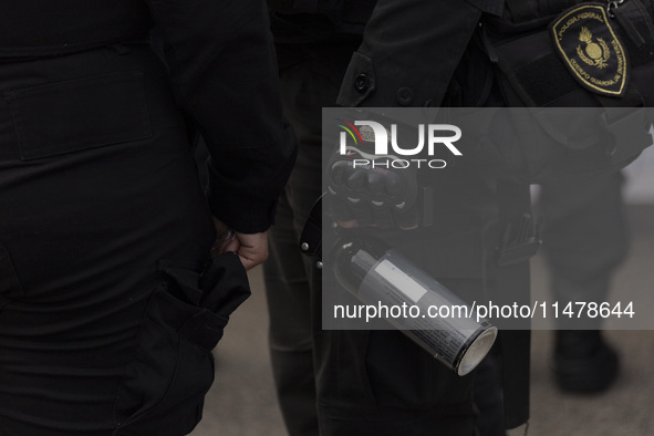 The Federal Police are holding pepper gas in their hand during a protest of Education Workers' Union in Buenos Aires, Argentina, on August 1...