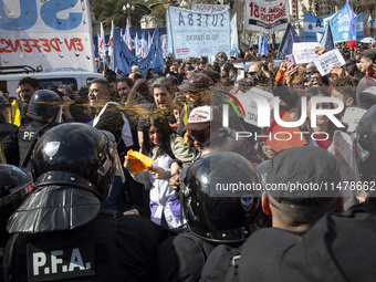 Federal Police are firing pepper spray at teachers who are demanding salary improvement during a protest of Education Workers' Union in Buen...