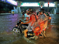 Vehicles are moving through the waterlogged road at Narayan Singh Circle following heavy monsoon rains in Jaipur, Rajasthan, India, on Wedne...