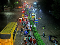 Vehicles are moving through the waterlogged road at Narayan Singh Circle following heavy monsoon rains in Jaipur, Rajasthan, India, on Wedne...