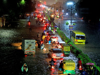 Vehicles are moving through the waterlogged road at Narayan Singh Circle following heavy monsoon rains in Jaipur, Rajasthan, India, on Wedne...