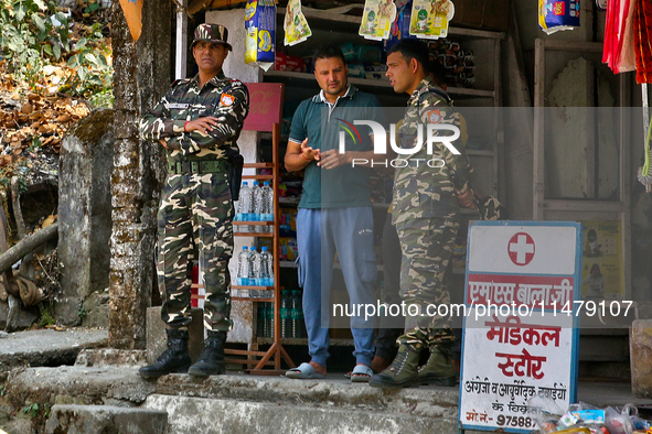 Soldiers from the Indian army are speaking with locals while on patrol in Kathgodam, Uttarakhand, India, on April 21, 2024. 