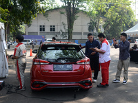 A car is being seen at one of the emission test locations during an exhaust emissions test (AU) in Bogor, West Java, Indonesia, on August 15...