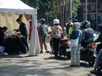 Queues of motorcycles are being seen at one of the emission test locations in Bogor, West Java, Indonesia, on August 15, 2024. This policy i...