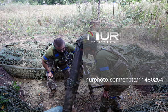 Servicemen of the 24th King Daniel of Galicia Separate Mechanized Brigade are firing a mortar at the positions of Russian troops near Chasiv...