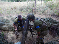 Servicemen of the 24th King Daniel of Galicia Separate Mechanized Brigade are firing a mortar at the positions of Russian troops near Chasiv...