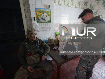 Servicemen of the 24th King Daniel of Galicia Separate Mechanized Brigade are resting during a break between combat missions near Chasiv Yar...