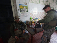 Servicemen of the 24th King Daniel of Galicia Separate Mechanized Brigade are resting during a break between combat missions near Chasiv Yar...