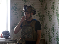 A serviceman of the 24th King Daniel of Galicia Separate Mechanized Brigade is smoking a cigarette during a break between combat missions ne...