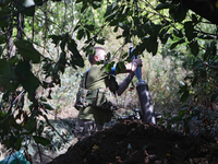 A serviceman of the 24th King Daniel of Galicia Separate Mechanized Brigade is loading a mortar while firing at the positions of Russian tro...