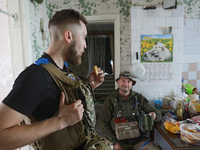 Servicemen of the 24th King Daniel of Galicia Separate Mechanized Brigade are resting during a break between combat missions near Chasiv Yar...