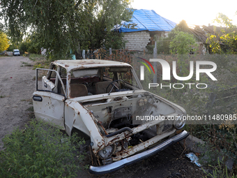 A destroyed civilian car is being left on the roadside in Kamianka village, Kharkiv region, Ukraine, on August 14, 2024, which is being dest...