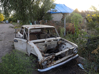 A destroyed civilian car is being left on the roadside in Kamianka village, Kharkiv region, Ukraine, on August 14, 2024, which is being dest...