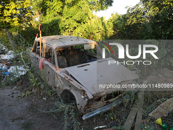 A destroyed civilian car is being left on the roadside in Kamianka village, Kharkiv region, Ukraine, on August 14, 2024, which is being dest...