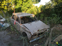 A destroyed civilian car is being left on the roadside in Kamianka village, Kharkiv region, Ukraine, on August 14, 2024, which is being dest...