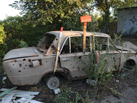 A destroyed civilian car is being left on the roadside in Kamianka village, Kharkiv region, Ukraine, on August 14, 2024, which is being dest...