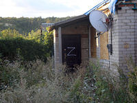 The letter Z is being painted on the door of a house in Kamianka village, Kharkiv region, which is being destroyed by Russian troops during...