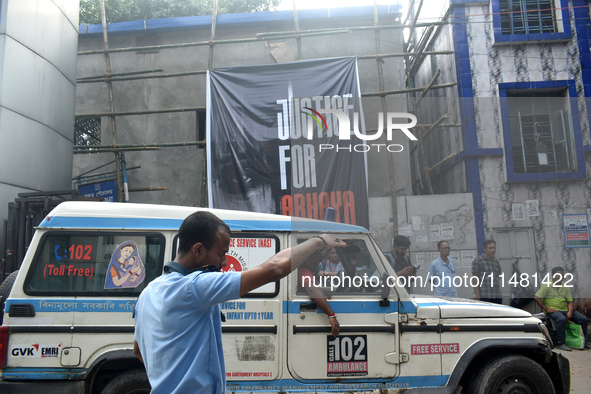 A security person is managing the traffic inside R G Kar Medical College in Kolkata, India, on August 15, 2024. 