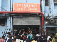 Media persons are standing outside of the emergency ward of R G Kar Medical College in Kolkata, India, on August 15, 2024. (