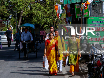 Indian tourists are walking along the Mall Road in Mussoorie, Uttarakhand, India, on April 18, 2024. (