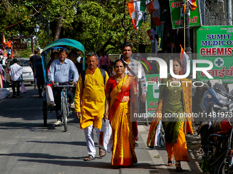 Indian tourists are walking along the Mall Road in Mussoorie, Uttarakhand, India, on April 18, 2024. (