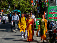 Indian tourists are walking along the Mall Road in Mussoorie, Uttarakhand, India, on April 18, 2024. (