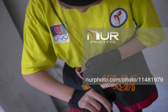 An Afghan refugee kickboxer is preparing to participate in an exercise session at a park in central Tehran, Iran, on August 15, 2024. 