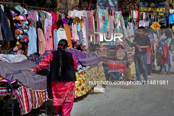 Members of the Tibetan community are selling clothing along the Mall Road in Mussoorie, Uttarakhand, India, on April 18, 2024. 