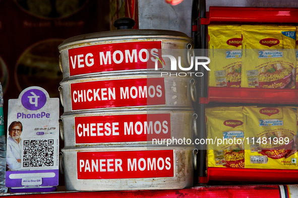 A roadside restaurant is offering momos and Maggi noodles along Mall Road in Mussoorie, Uttarakhand, India, on April 18, 2024. 