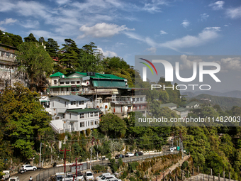 Buildings are being seen along the mountainside in Mussoorie, Uttarakhand, India, on April 18, 2024. (