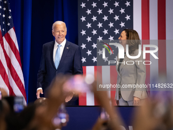 President Joe Biden and Vice President Kamala Harris arrive on stage to raucous applause as they announce reduced Medicare prices for ten wi...