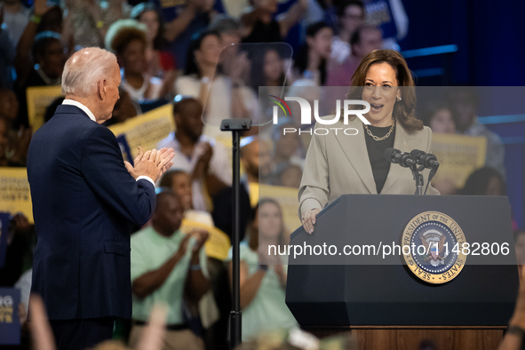 President Joe Biden and the audience cheer Vice President Kamala Harris during an event announcing reductions in Medicare prices for ten wid...